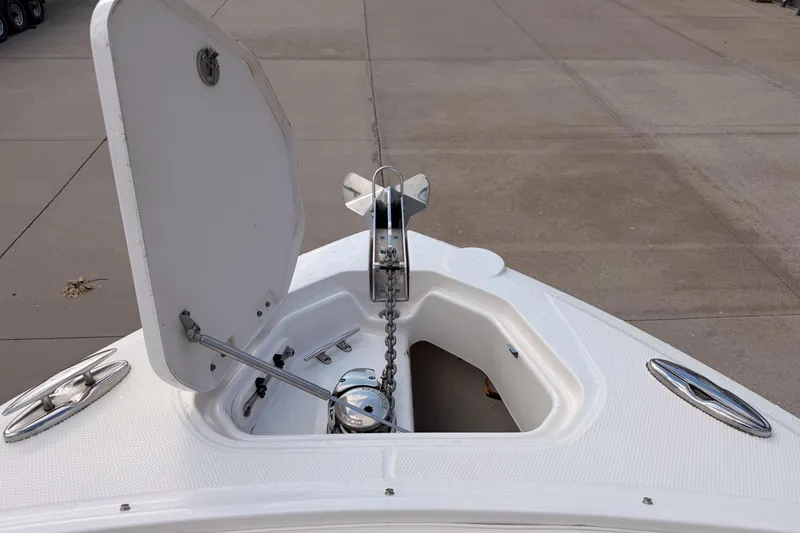 Slide: The Image of Bow anchor compartment of 2012 Chaparral 327 SSX boat with open hatch. - 19