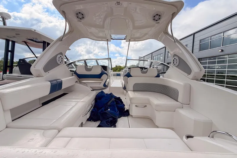 Slide: The Image of 2012 Chaparral 327 SSX boat interior with white seating and modern design. - 10