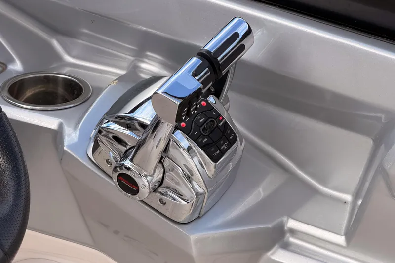 Slide: The Image of Chrome throttle control on 2012 Chaparral 327 SSX boat dashboard. - 28