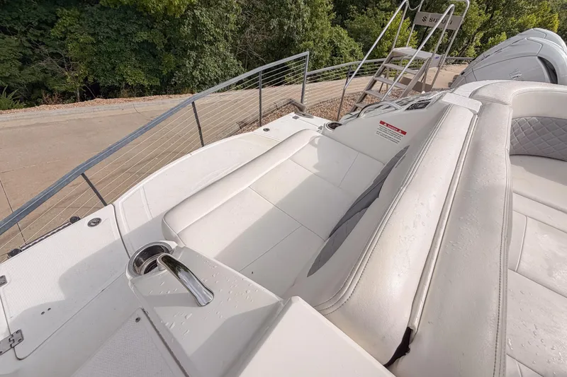 Slide: The Image of 2012 Chaparral 327 SSX boat with white seating and stainless steel railing. - 9