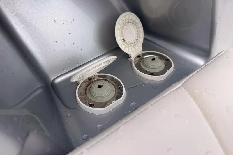Slide: The Image of Open compartments on a 2012 Chaparral 327 SSX boat with water droplets. - 20