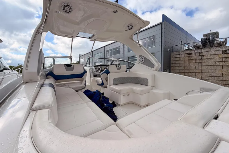 Slide: The Image of 2012 Chaparral 327 SSX boat interior with white seating and modern design. - 11