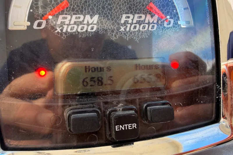 Slide: The Image of Close-up of Chaparral 327 SSX 2012 boat dashboard showing 658.5 engine hours. - 16