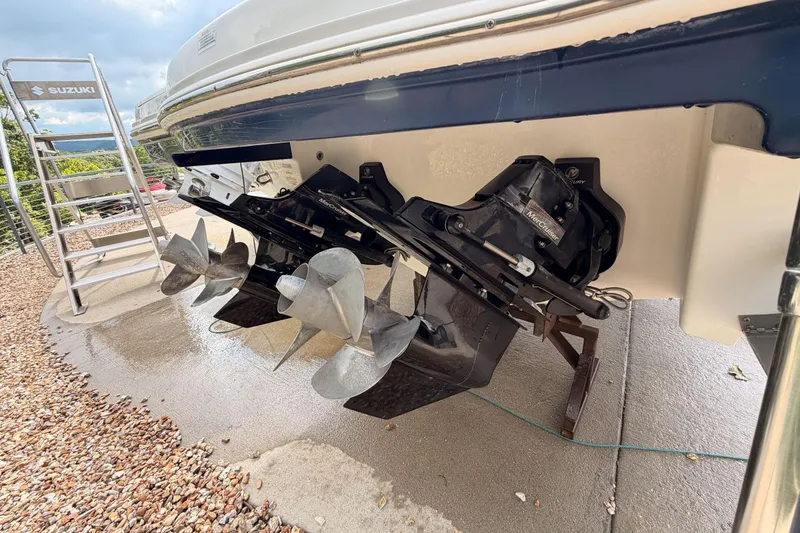 Slide: The Image of Rear view of 2012 Chaparral 327 SSX boat with dual propellers and Suzuki ladder. - 5