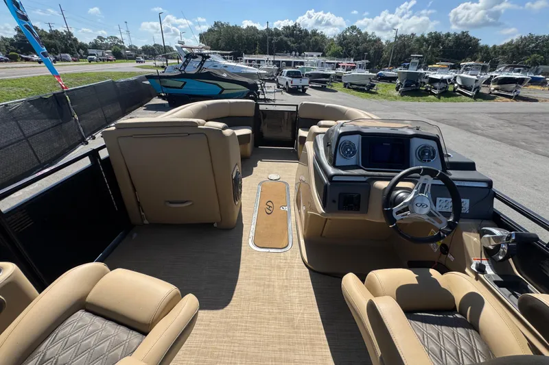 Slide: The Image of Interior view of 2021 Harris Solstice 230 boat with beige seating and modern dashboard. - 42