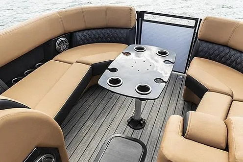 Slide: The Image of Manufacturer Provided Image: 2021 Harris Solstice 230 boat interior with tan seating and black table. - 10