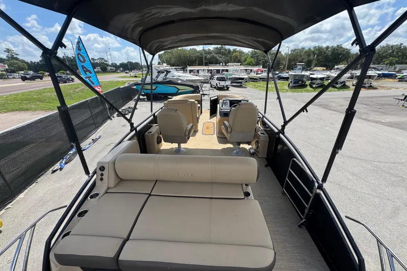 Slide: The Image of 2021 Harris Solstice 230 pontoon boat interior with seating and canopy. - 34