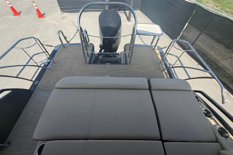 Slide: The Image of The image shows the deck of a 2021 Harris Solstice 230 with beige upholstery. - 28