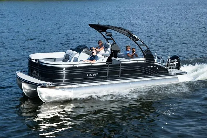 The Image of Manufacturer Provided Image: 2021 Harris Solstice 230 pontoon boat cruising on a lake. - 0