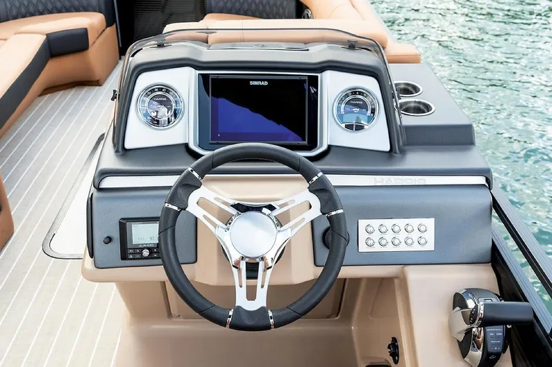 Slide: The Image of Manufacturer Provided Image: 2021 Harris Solstice 230 boat dashboard with steering wheel and control panel. - 12