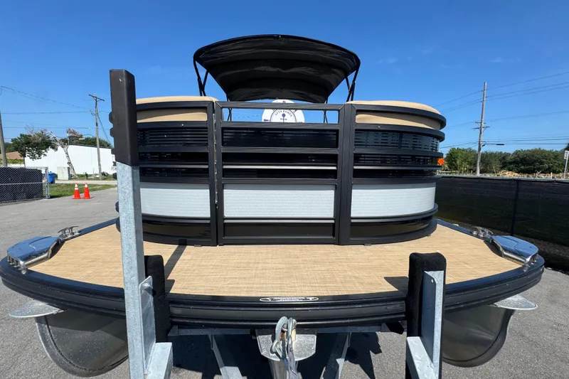 Slide: The Image of 2021 Harris Solstice 230 pontoon boat on trailer, sunny day, front view. - 8