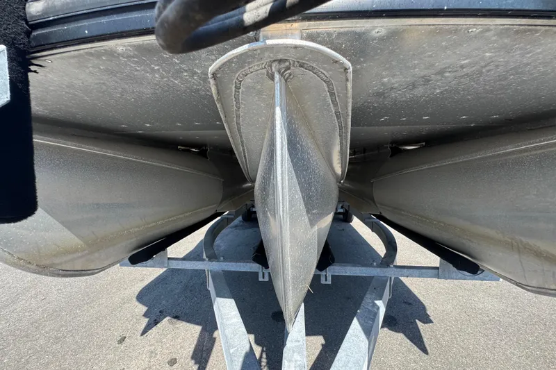 Slide: The Image of Underneath view of a 2021 Harris Solstice 230 pontoon boat on a trailer. - 9