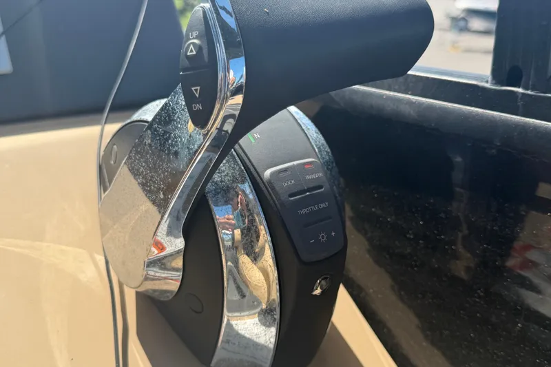 Slide: The Image of Throttle control lever on a 2021 Harris Solstice 230 boat. - 56