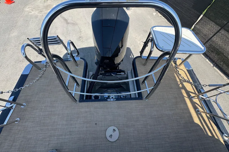 Slide: The Image of Rear view of 2021 Harris Solstice 230 boat with motor and safety railings. - 30