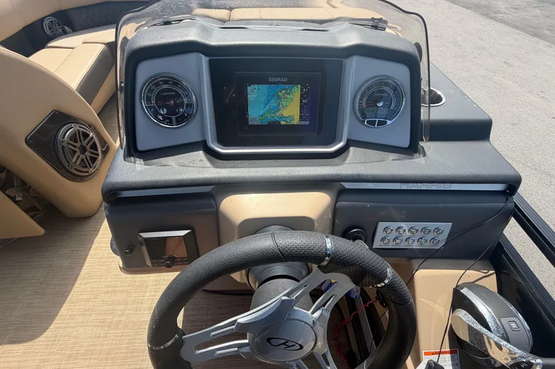 Slide: The Image of Dashboard of a 2021 Harris Solstice 230 boat with navigation display and controls. - 51