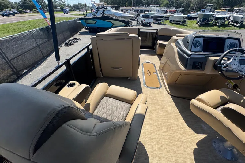 Slide: The Image of Interior of a 2021 Harris Solstice 230 boat with luxurious seating and modern dashboard. - 40
