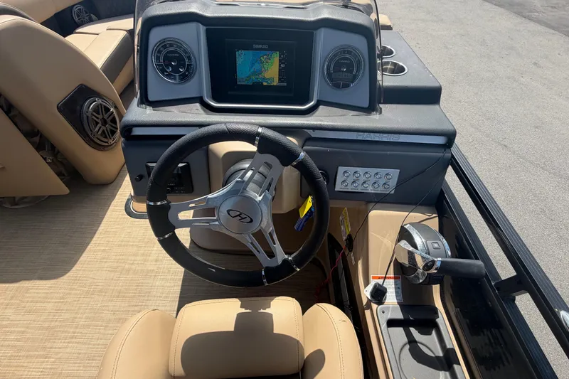 Slide: The Image of Steering console of 2021 Harris Solstice 230 boat with navigation display and controls. - 50