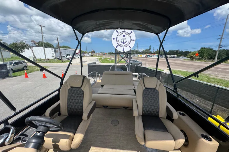 Slide: The Image of Interior view of 2021 Harris Solstice 230 boat with luxurious seating and canopy. - 13