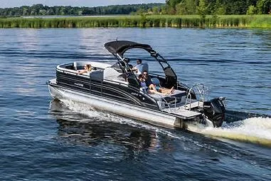 Slide: The Image of Manufacturer Provided Image: 2021 Harris Solstice 230 pontoon boat cruising on a lake. - 4
