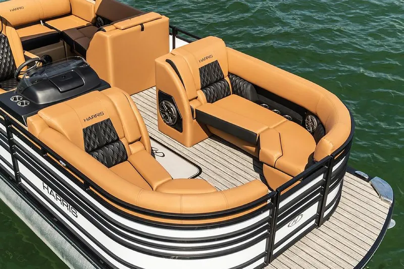 Slide: The Image of Manufacturer Provided Image: 2021 Harris Solstice 230 pontoon boat with luxurious tan seating on the water. - 8