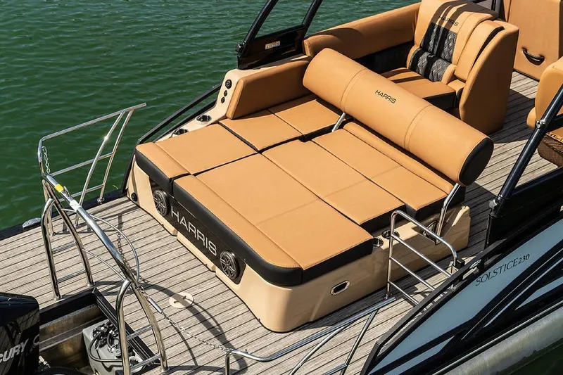 Slide: The Image of Manufacturer Provided Image: 2021 Harris Solstice 230 boat with tan seating and sun deck on water. - 15