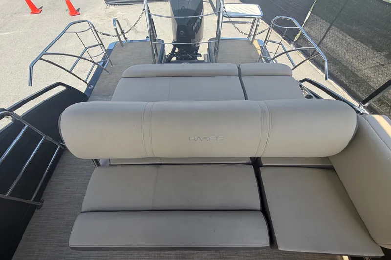Slide: The Image of The image shows the sun deck of a 2021 Harris Solstice 230 with beige upholstery. - 21