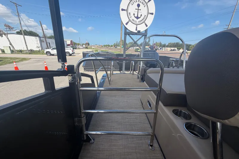 Slide: The Image of Interior view of a 2021 Harris Solstice 230 pontoon boat with seating and railing. - 25