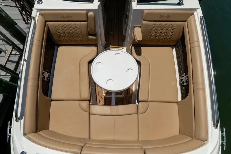 Slide: The Image of Luxurious seating area on 2022 Sea Ray SDX 290 boat with tan upholstery and round table. - 58