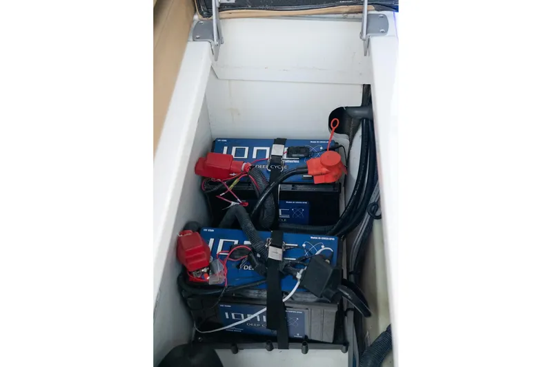 Slide: The Image of Battery compartment of 2022 Sea Ray SDX 290 boat with wiring and connectors. - 50