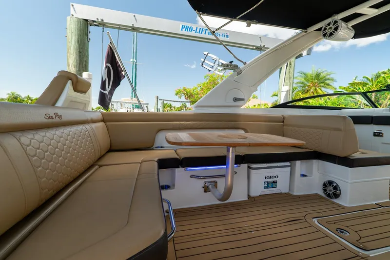 Slide: The Image of Luxurious interior of 2022 Sea Ray SDX 290 boat with elegant seating and table. - 31