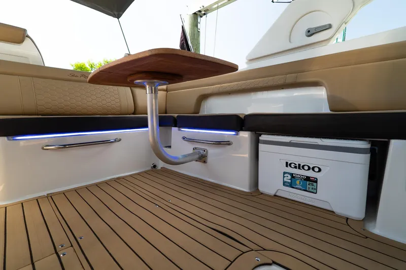 Slide: The Image of Interior of 2022 Sea Ray SDX 290 boat with seating and Igloo cooler. - 39