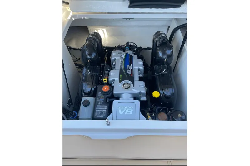 Slide: The Image of Engine compartment of 2022 Sea Ray SDX 290 boat, featuring a powerful V8 engine. - 64