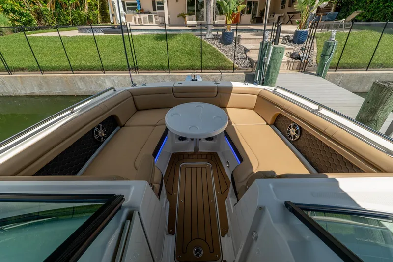 Slide: The Image of Luxurious 2022 Sea Ray SDX 290 boat interior with tan seating and table. - 29