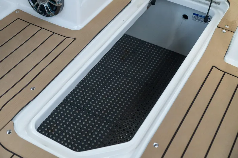 Slide: The Image of Storage compartment on 2022 Sea Ray SDX 290 boat with non-slip flooring. - 45