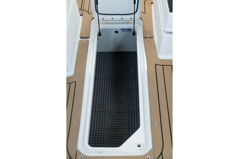 Slide: The Image of Storage compartment on 2022 Sea Ray SDX 290 boat with non-slip flooring. - 46