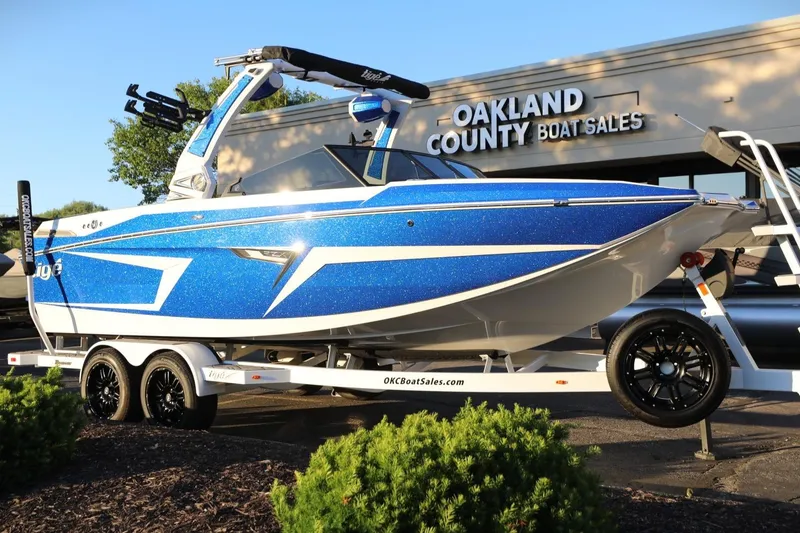 The Image of 2024 Tigé 22RZX boat in blue, displayed at Oakland County Boat Sales. - 1