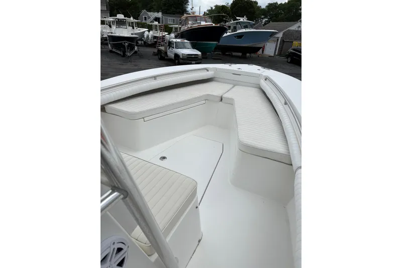 Slide: The Image of 2008 Regulator 23 Forward Seating boat with spacious white seating area. - 17