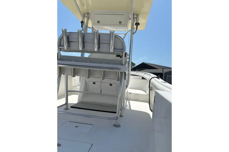 Slide: The Image of 2008 Regulator 23 Forward Seating boat interior with rod holders and seating. - 6