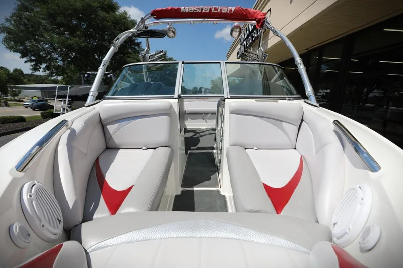 Slide: The Image of 2007 MasterCraft X-15 boat interior with white and red seating, outdoor setting. - 7