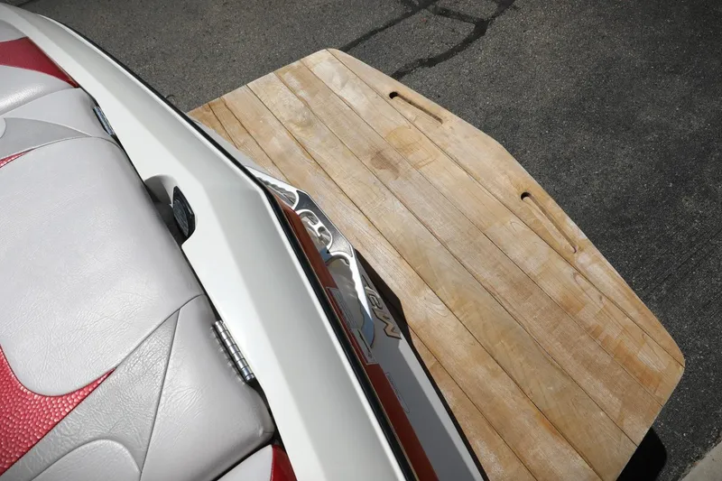 Slide: The Image of 2007 MasterCraft X-15 boat with wooden swim platform and red-white seating. - 13