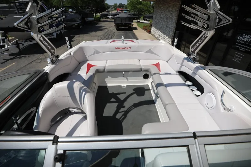 Slide: The Image of 2007 MasterCraft X-15 boat interior with white seating and cup holders. - 11