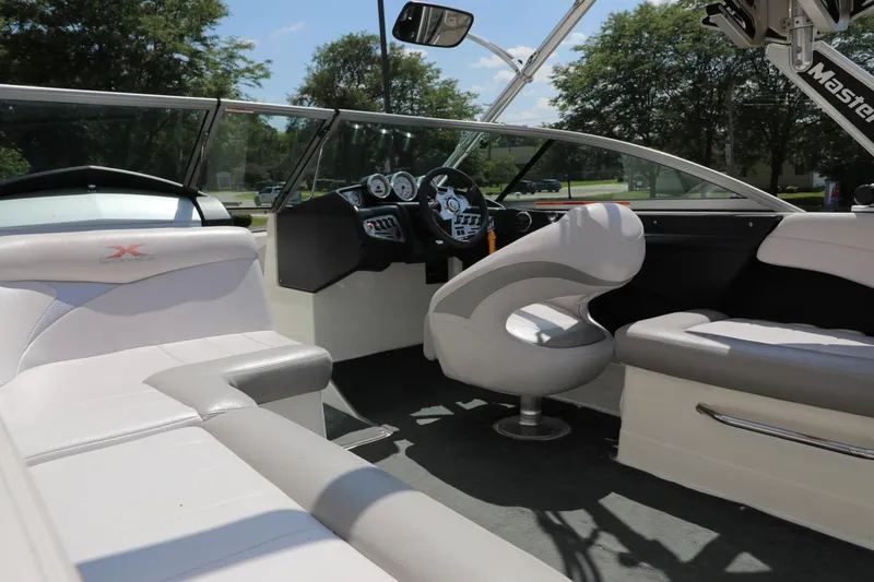 Slide: The Image of Interior of a 2007 MasterCraft X-15 boat with sleek seating and modern dashboard. - 5