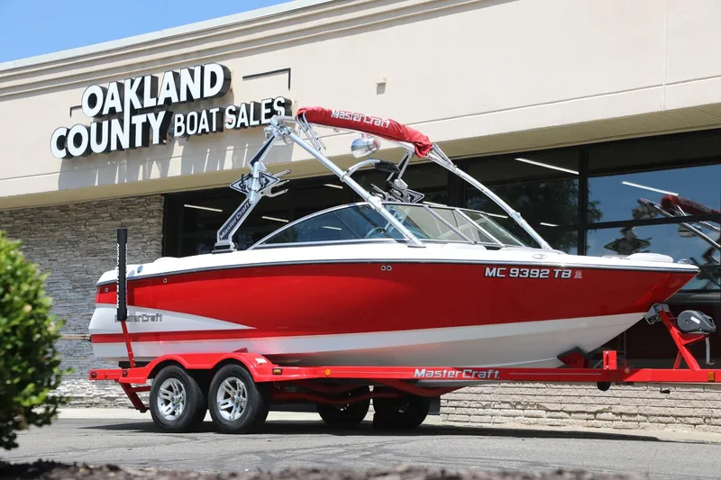 Slide: The Image of Red 2007 MasterCraft X-15 boat on trailer at Oakland County Boat Sales. - 1