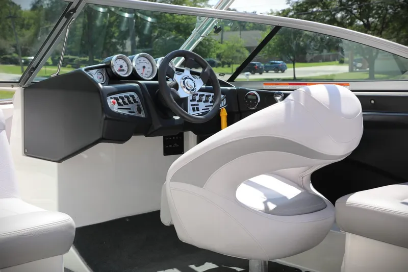 Slide: The Image of 2007 MasterCraft X-15 boat interior with steering wheel and dashboard controls. - 6