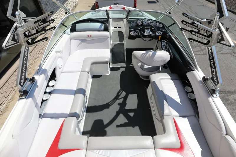 Slide: The Image of 2007 MasterCraft X-15 boat interior with white seating and dashboard view. - 10