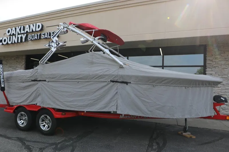 Slide: The Image of 2007 MasterCraft X-15 boat covered on trailer at Oakland County Boat Sales. - 12