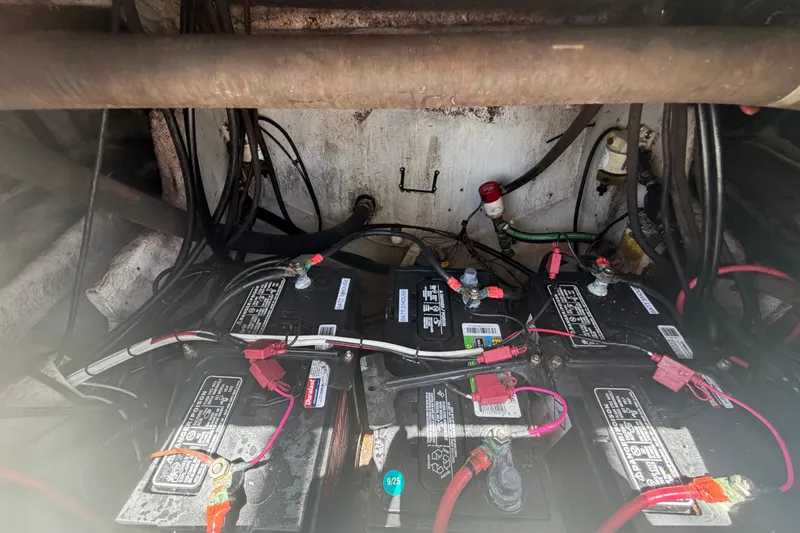 Slide: The Image of Battery compartment of a 2006 Pro Sports 2550 BW boat with wiring and connections. - 65