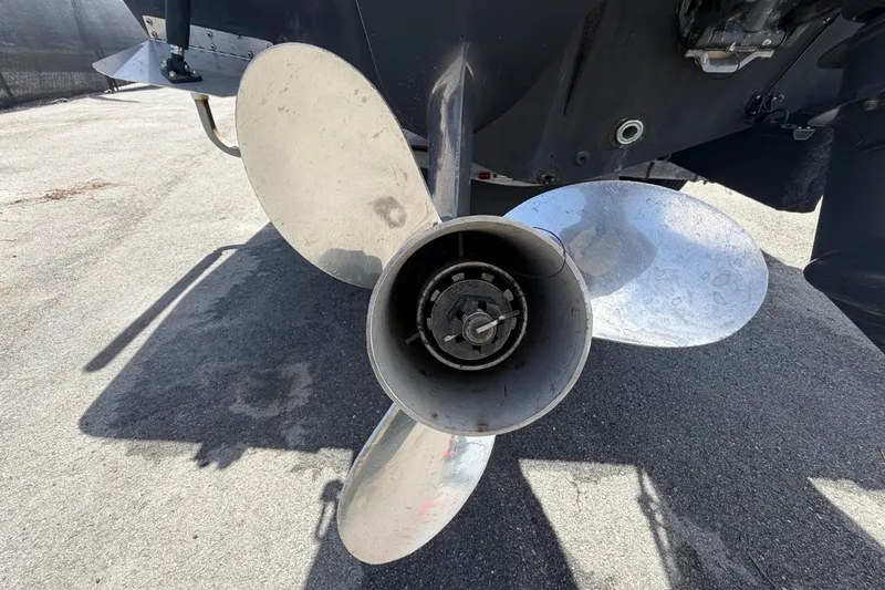 Slide: The Image of Close-up of a 2006 Pro Sports 2550 BW boat propeller on a concrete surface. - 7
