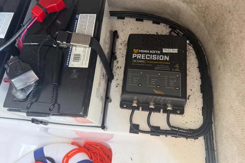 Slide: The Image of Battery setup with Minn Kota Precision charger in 2006 Pro Sports 2550 BW boat. - 56
