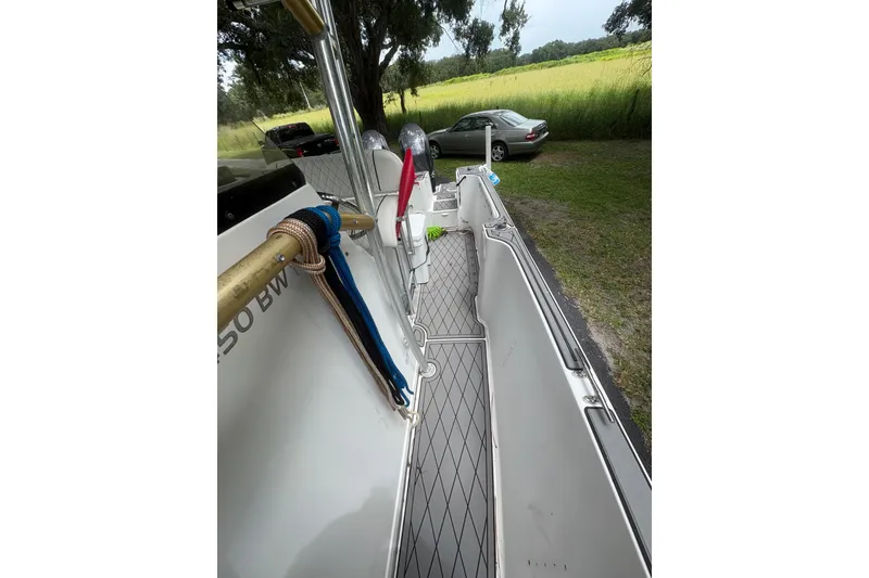 Slide: The Image of 2006 Pro Sports 2550 BW boat interior with ropes and outdoor view. - 10